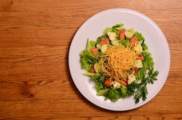 Ethical vegetarian or vegan meal. Boiled quail eggs in a spiralized fried potato french fries nest, Served with baby leaf salad. Healthy low calorie slimmer's meal made with a spiralizer.