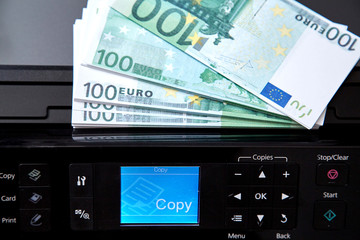 Banking and economic or financial crisis. Inflation and depreciation money concept. The printer and the Euro banknotes.