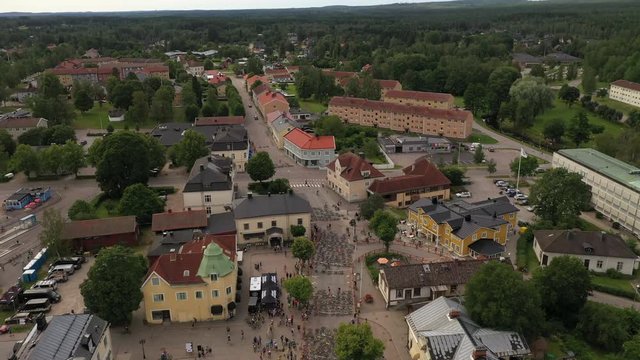 Drone footage showing pre start of an MTB race with mountainbikes laying on the street marking the start position. Filmed in realtime.