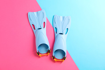 Blue flippers on two tone background, space for text
