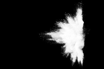 Freeze motion of white color powder exploding on dark background. 