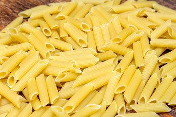 spaghetti, maccheroni, penne, macaroni, pasta traditional Italian on wooden background close up selective focus