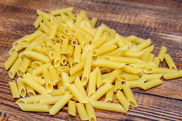 spaghetti, maccheroni, penne, macaroni, pasta traditional Italian on wooden background close up selective focus