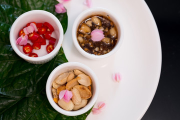 Thai Style wrapped appetizer with sweet and spicy dips