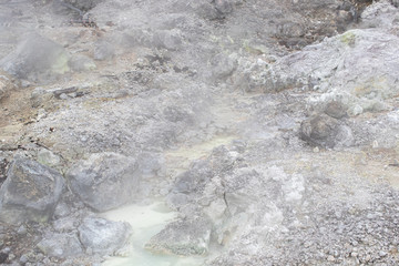 stone or rock with hell hot springs located at active volcano mountain.