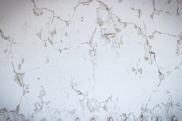 Decrepit white plaster wall. Old background and texture.