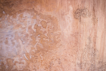 Fototapeta premium Red dirty plaster wall. Ancient background and texture.