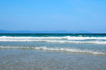 Panorama of a deserted beach with clear blue water. Cold North sea. Travel and leisure concept. Tourist background. Screensaver on your computer.