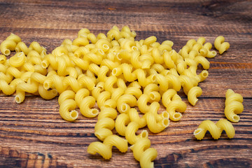 spaghetti, cavatappi, macaroni, pasta traditional Italian on wooden background close up selective focus