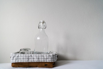 Hotel basic accommodation. Include, glass of bottle, glass of water orderly in the wooden tray.