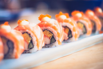 Salmon sushi roll, Japanese food, vintage tone, (selective focus point)