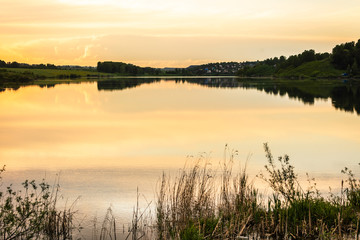 Fototapeta na wymiar sunset on the lake.water surface of the lake