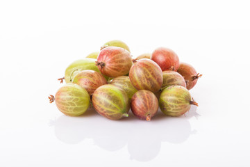 heap of green gooseberries isolated on white background