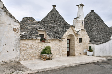 Old trulli houses in Alberobello town in Italy
