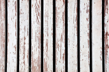 Peeled grunge rustic white wooden fence texture for background and backdrop use.