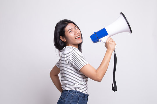 Beautiful young Asian woman announce with megaphone.