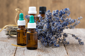 Essential oil and dry lavender flowers