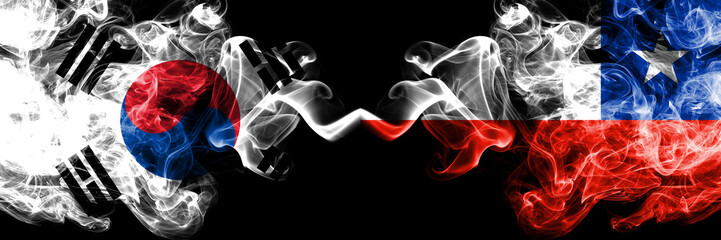 South Korea vs Chile, Chilean smoky mystic flags placed side by side. Thick colored silky abstract smoke flags of South Korean and Chile, Chilean