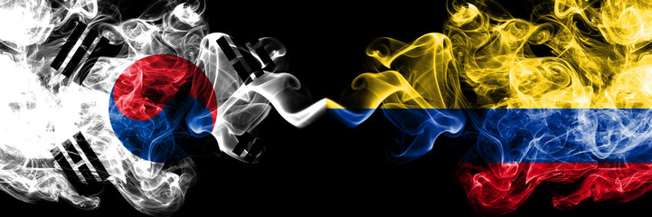 South Korea vs Colombia, Colombian smoky mystic flags placed side by side. Thick colored silky abstract smoke flags of South Korean and Colombia, Colombian