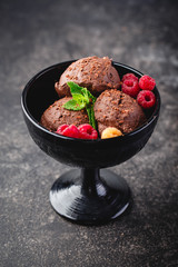 Three brown chocolate ice cream balls