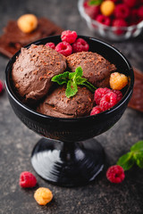 Three brown chocolate ice cream balls