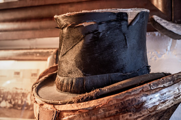 old worn ratty top hat