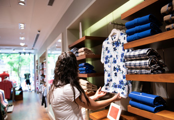 Blurred showcases fashion boutique with sportswear. Blurred big sales on Black Friday. On sale at a clothing store in a modern shopping mall beautiful lobby at the malls. Big sales.