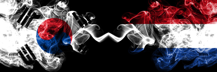 South Korea vs Netherlands, Dutch smoky mystic flags placed side by side. Thick colored silky abstract smoke flags of South Korean and Netherlands, Dutch