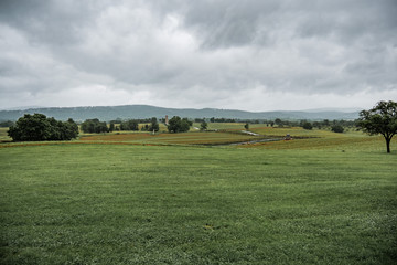 Fototapeta na wymiar Cloudy storm over a field of grass