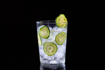 Cucumber water on black background.