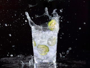 Cucumber water on black background.