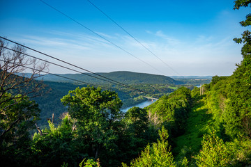 View from the mountains over rolling hills and power cables