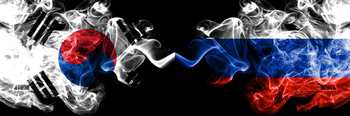 South Korea vs Russia, Russian smoky mystic flags placed side by side. Thick colored silky abstract smoke flags of South Korean and Russia, Russian