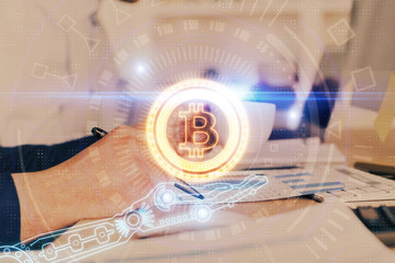 Man's hands working with notes background. Cryptocurrency and finance concept.