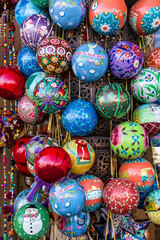 Fototapeta na wymiar Muscat, Oman: New Year decorative balls on Muscat souvenir market.