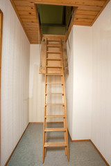 Wooden folding ladder to the attic, old empty house © annebel146