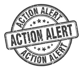 action alert stamp. action alert round grunge sign. action alert