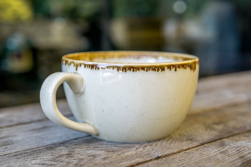 cup of coffee on a wooden table
