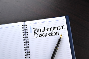 Notebook with fountain pen written word Fundamental Discussion