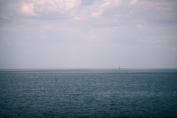 lonely sailboat on the sea