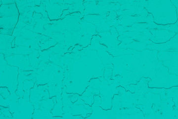 The texture of the old peeling paint aquamarine color.