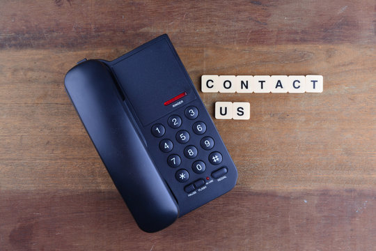 Contact Us Concept. Telephone with word "Contact US"
