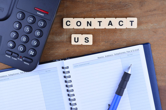 Contact Us Concept. Telephone with word "Contact US"