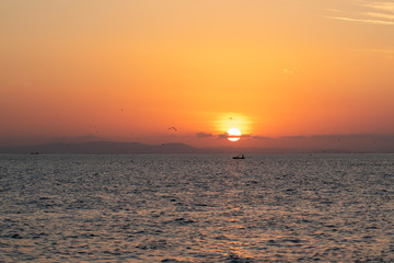 Sunset and Fisherman