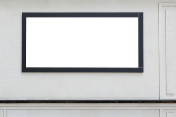 Blank billboard on a white wall.