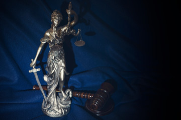 The judge's gavel and justice on a dark blue background