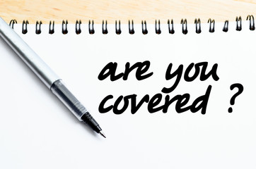 Obraz premium pen writes are you covered on white blank paper