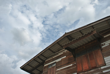 Residential wooden houses and the sky backdrop in Thailand