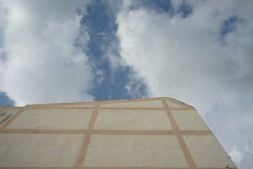 5-storey reinforced concrete building and sky backdrop