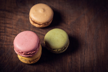 Macaroons on the wooden table